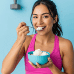 A person enjoying a bowl of high-protein Cottage Cheese Ice Cream.