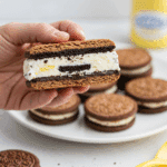 A platter of Oreo-Stuffed Ice Cream Sandwiches at a party.
