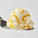 A perfect scoop of the homemade vanilla ice cream with pineapple swirl.