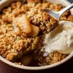 A spoonful of the warm and gooey Single-Serve Apple Crumble.