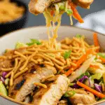 A delicious serving of the finished Grilled Asian Chicken Salad in a bowl.