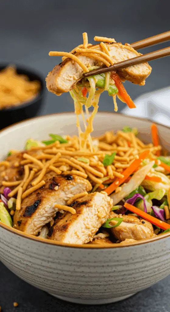 A delicious serving of the finished Grilled Asian Chicken Salad in a bowl.