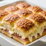 The finished, golden-brown baked Ham and Cheese Sliders fresh from the oven.