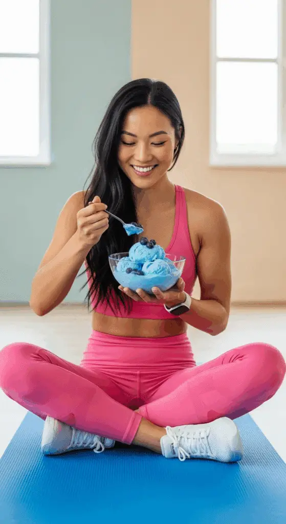 A person enjoying a bowl of High Protein Blueberry Cottage Cheese Ice Cream as a post-workout treat