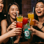 A group of happy friends enjoying their Mango Melona Soju Cocktails at a party