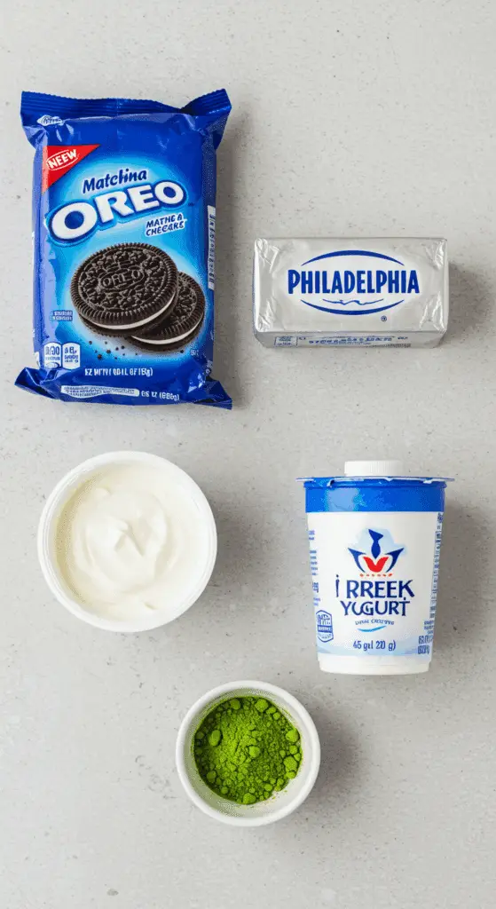 The simple, modern ingredients for the No-Bake Matcha Cheesecake recipe with an Oreo crust.
