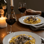 A romantic, candlelit dinner for two featuring plates of Fettuccine with Mushroom-Gorgonzola Cream Sauce.