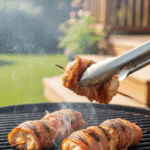 SEO Alt Text: Cooked Prosciutto-Wrapped Chicken Kebabs being lifted off a hot grill.
