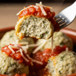 A forkful of a finished Herb-Ricotta Dumpling with sauce.