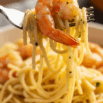 A forkful of the finished Shrimp Scampi with a juicy shrimp.