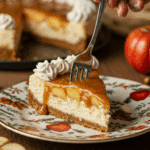 A beautiful slice of Caramel Apple Cheesecake being served as dessert at a festive Thanksgiving dinner.