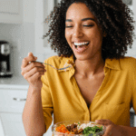 A person happily eating a healthy and delicious Hot Honey Ground Beef Bowl for lunch.
