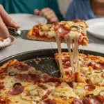The finished, homemade BLT Pizza being served at a fun and casual family pizza night.