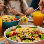 A beautiful bowl of homemade, healthy Turkey Taco Salad being enjoyed for a fun and casual family dinner.