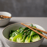 A cozy bowl of homemade, healthy Bok Choy Stir Fry being served with chopsticks for a family dinner.