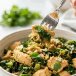 A beautiful bowl of homemade, healthy Turkey Kale Rice Bowl being served for a delicious weeknight dinner.