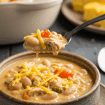 A cozy bowl of homemade, creamy White Chicken Chili being served for a casual family dinner.