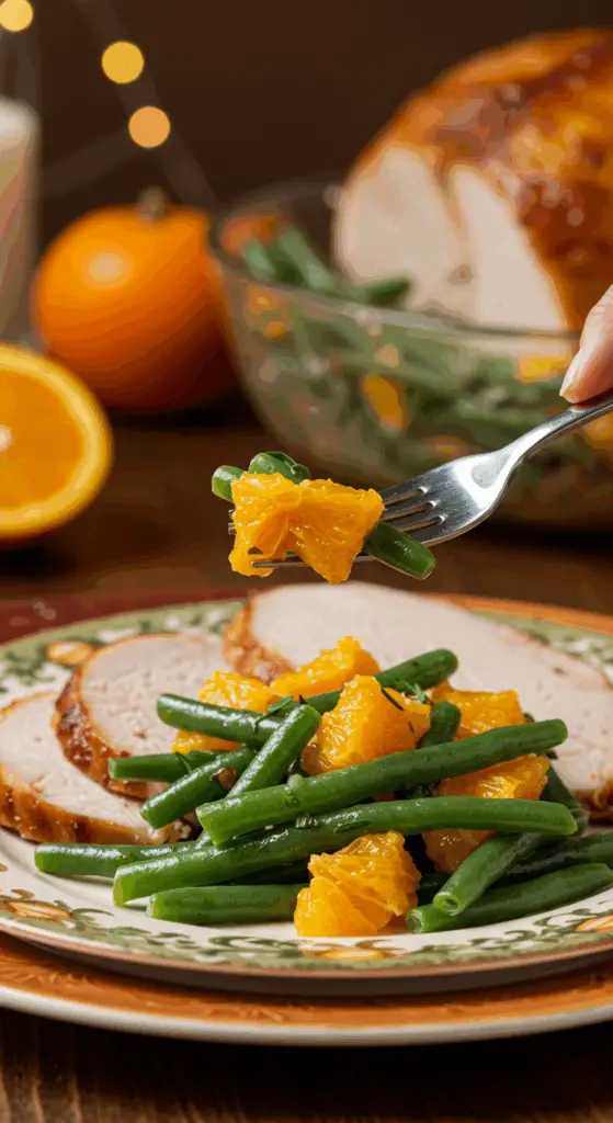 A beautiful plate of a homemade, elegant, and vibrant Green Bean and Orange Salad, being served with a thick slice of a roasted turkey at a Thanksgiving dinner.