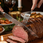 The whole, homemade, impressive, and crusted Prime Rib being carved as the centerpiece at a fun and sophisticated Christmas party.